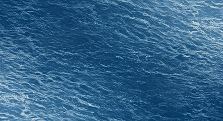 Explore an abstract texture of cold water ripples captured directly from a top-down perspective. Creates a dynamic and natural background or overlay.の写真素材