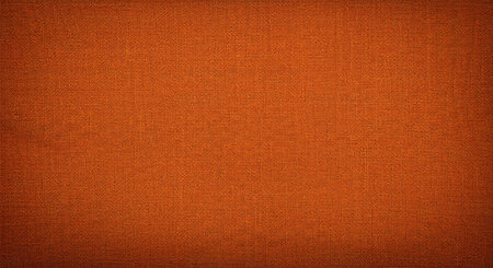 A textured dark orange burlap background features a pronounced weave and fibrous threads. This...