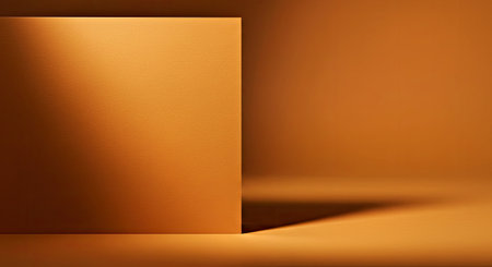 This textured ochre cardstock backdrop showcases a gentle shadow graduation. The warm tone and soft shading create an appealing background for various creative applications.の写真素材