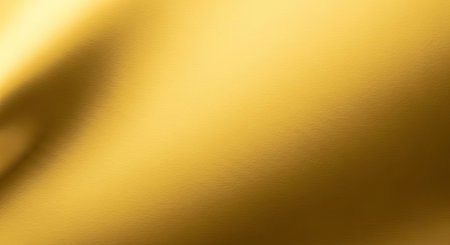 Shiny Gold Foil Paper Texture Smooth Glossy Finish Bright Metallic Highlightsの写真素材
