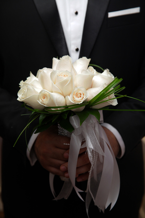 the groom, the bride, the couple, Bridal bouquet, closeup of the hands, wedding rings, champagne glassesの写真素材