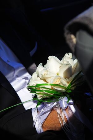 the groom, the bride, the couple, Bridal bouquet, closeup of the hands, wedding rings, champagne glassesの写真素材