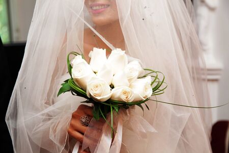 the groom, the bride, the couple, Bridal bouquet, closeup of the hands, wedding rings, champagne glassesの写真素材