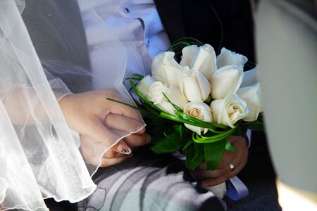 the groom, the bride, the couple, Bridal bouquet, closeup of the hands, wedding rings, champagne glassesの写真素材