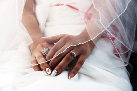 the groom, the bride, the couple, Bridal bouquet, closeup of the hands, wedding rings, champagne glassesの写真素材