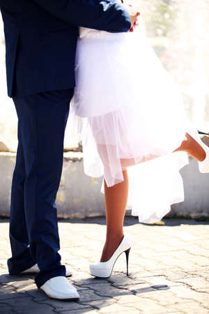the bride and groom close up the house, walking in the city hdの写真素材