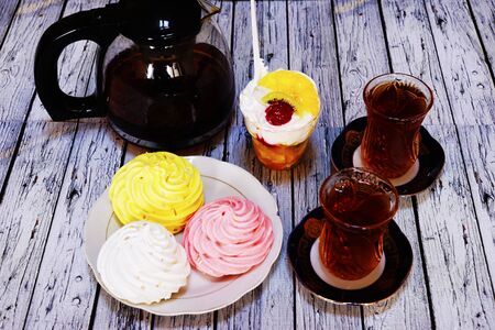 Sweet baklava on plate with tea on table in roomの写真素材