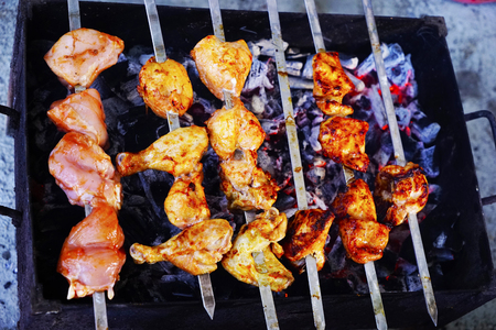 Shish Kebab of pork and chicken with a mix of spices roasted over charcoalの写真素材