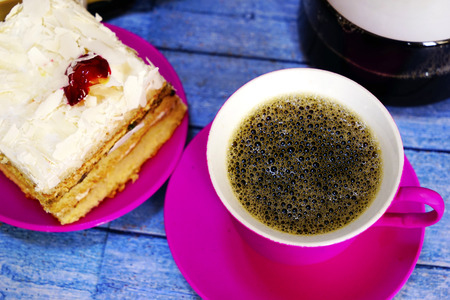 Eastern Turkish sweets baklava and cup of coffee on wooden tableの写真素材