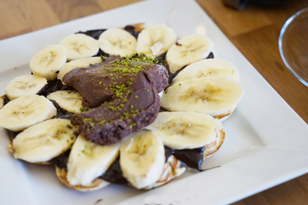Chocolate banana cake for a breakfast on the plateの写真素材