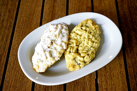 Oriental Turkish pastries with cream and fruit on a white plateの写真素材