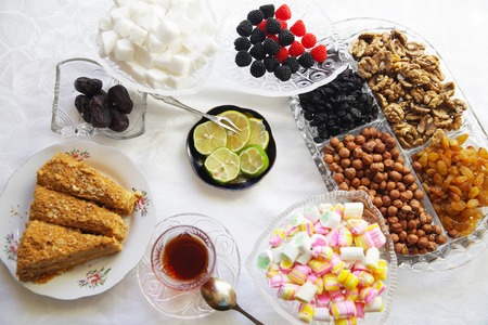 Eastern Turkish delight nuts tea on the tableの写真素材