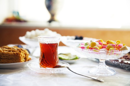 Eastern Turkish delight nuts tea on the tableの写真素材