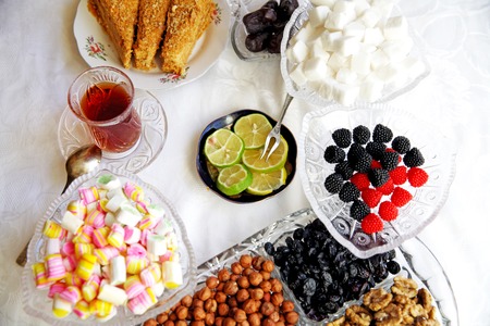 Eastern Turkish delight nuts tea on the tableの写真素材