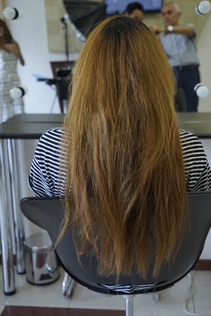 Beautiful wedding hairstyle. The bride's hairstyle in the beauty salon. Rear view.の写真素材