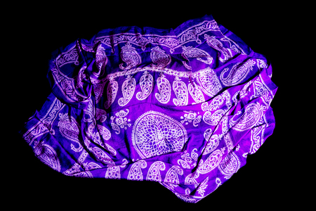 colorful Turkish Oriental beautiful scarves with pictures of natural silk on a black backgroundの写真素材