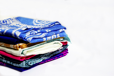 colorful Turkish Oriental beautiful scarves with pictures of natural silk on a white backgroundの写真素材
