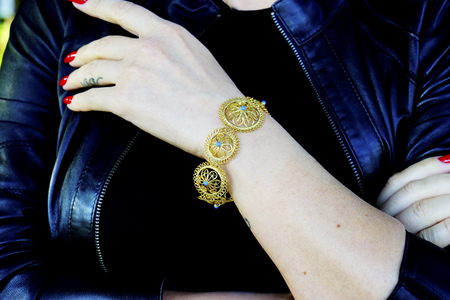 beautiful vintage gold Turkish Oriental handmade bracelets on the model's handの写真素材