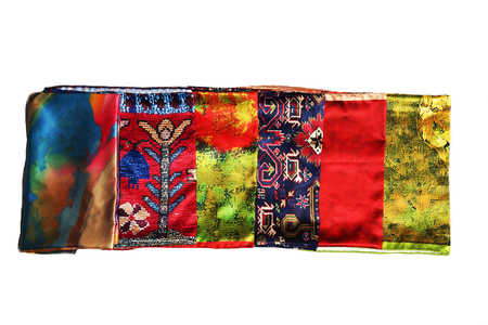 colorful Turkish Oriental beautiful scarves with pictures of natural silk on a white backgroundの写真素材