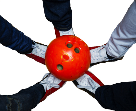 children's feet in shoes and a bowling ball for the gameの写真素材