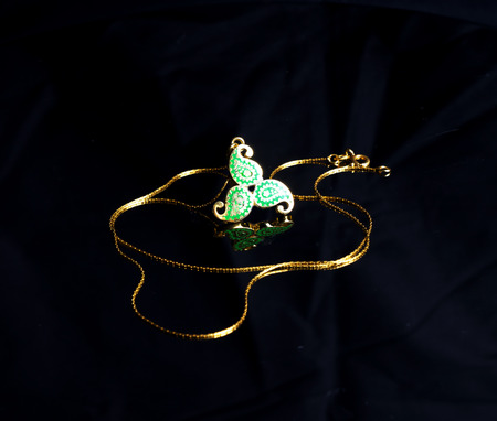 female Golden Eastern Turkish vintage women's handmade jewelry on a black background.earrings, bracelets, rings, pendantsの写真素材