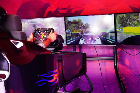 BAKU, AZERBAIJAN - MAY 17, 2016: Public race car Simulator on Ferrari F1 with large audience at Expo Tuning Baku is the premier automotive specialty event in the Azerbaijan on May 17, 2016のeditorial素材