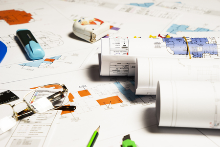 Construction plans with helmet and drawing tools on blueprintsの写真素材