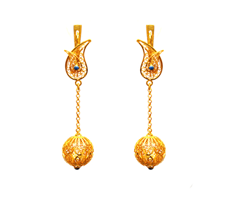 female Golden Eastern Turkish vintage womens handmade jewelry on a white background.earrings,の写真素材