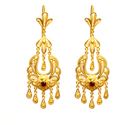 female Golden Eastern Turkish vintage womens handmade jewelry on a white background.earrings,の写真素材