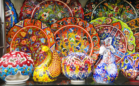 multi-colored decorative Turkish Oriental ornamental ceramic ware on the shelves of the storeの写真素材
