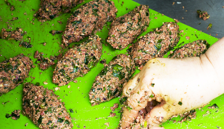 A woman hands cooking vegetarian cutletsの写真素材