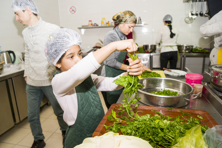 Baku, Azerbaijan-10 March 2018 : the chefs prepare vegetarian dishesのeditorial素材