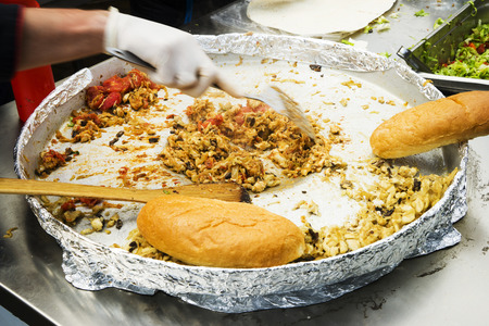 Chef prepares traditional turkish food kebab , pilaf . It is also used as fast food in the form of...