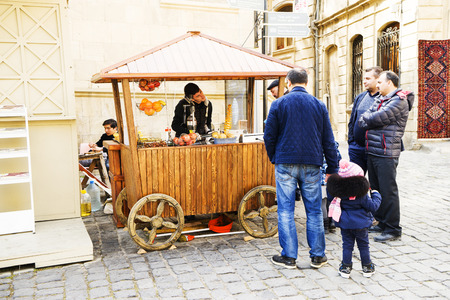 BAKU, AZERBAYJAN-19 MAY 2017 : a crowd of people walking on the streets of the city with sellers of fast food, kebab and street restaurantsのeditorial素材