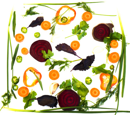 Assortment of fresh colorful organic vegetables in white tray on wooden pine table, food background, top viewの写真素材