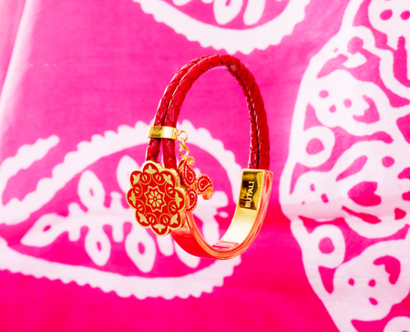 female Golden silver Eastern Turkish vintage women's handmade jewelry on a red background. braceletsの写真素材
