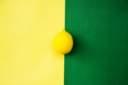 Yellow lemons on yellow green pastel background, concepts,summer ideas of fruit, vegetable, healthy eating lifestyle, flat layの写真素材