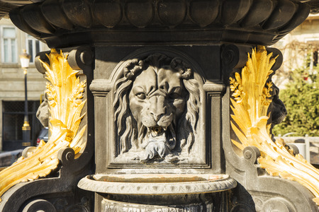 statue of a man in a fountain in gardenの写真素材