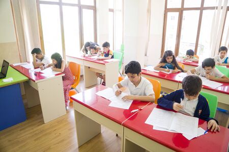 Baku, Azerbaijan, 15 may 2018: group of students engaged in learning at the desk in the classroom.のeditorial素材