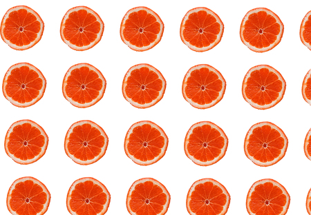 blank white background arranged by many grapefruit slices from top and bottom.の写真素材