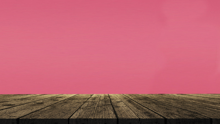 Empty of wood table top on color 2019 living coral background.For montage product display or design key visual layout.の写真素材