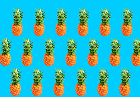 set Colorful fruit pattern of fresh pineapple on blue background. Top view. Flat lay. Summer...