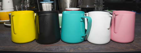 colorful cups and mugs for coffee and tea on the bar counter.の写真素材