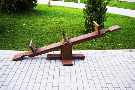 Wooden Baby swing in the park very closeの写真素材