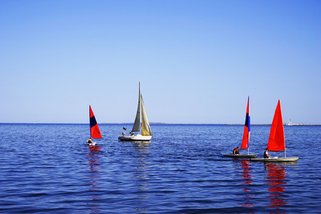Luxury yachts at Sailing regatta. Sailing in the wind through the waves at the Sea.の写真素材