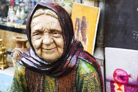 BAKU, AZERBAIJAN, JUNE 27, 2018: the monument of an old Eastern woman stands on the streetのeditorial素材
