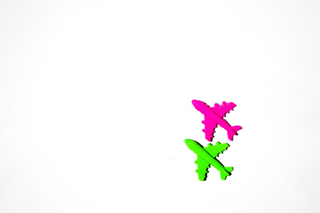 plastik red and green airplane toy on white background.