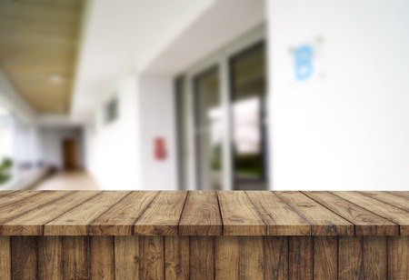 Wooden brown table top against the blurred corridor, passage and courtyard of the house .For product display montage or design is the key visual of the layoutの写真素材