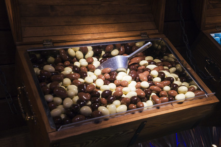 different chewing gum in wooden boxes in the store