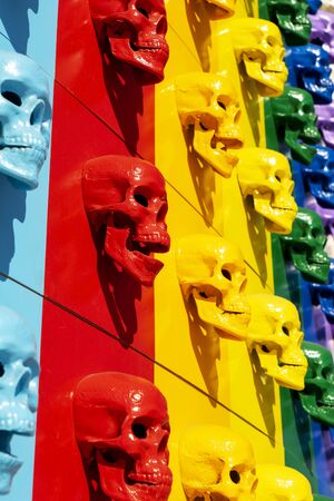A collection of multi-colored skulls laid out in a line. Halloween conceptの写真素材